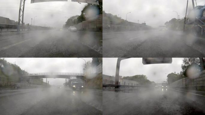 在多雨的高速公路上行驶/后视图