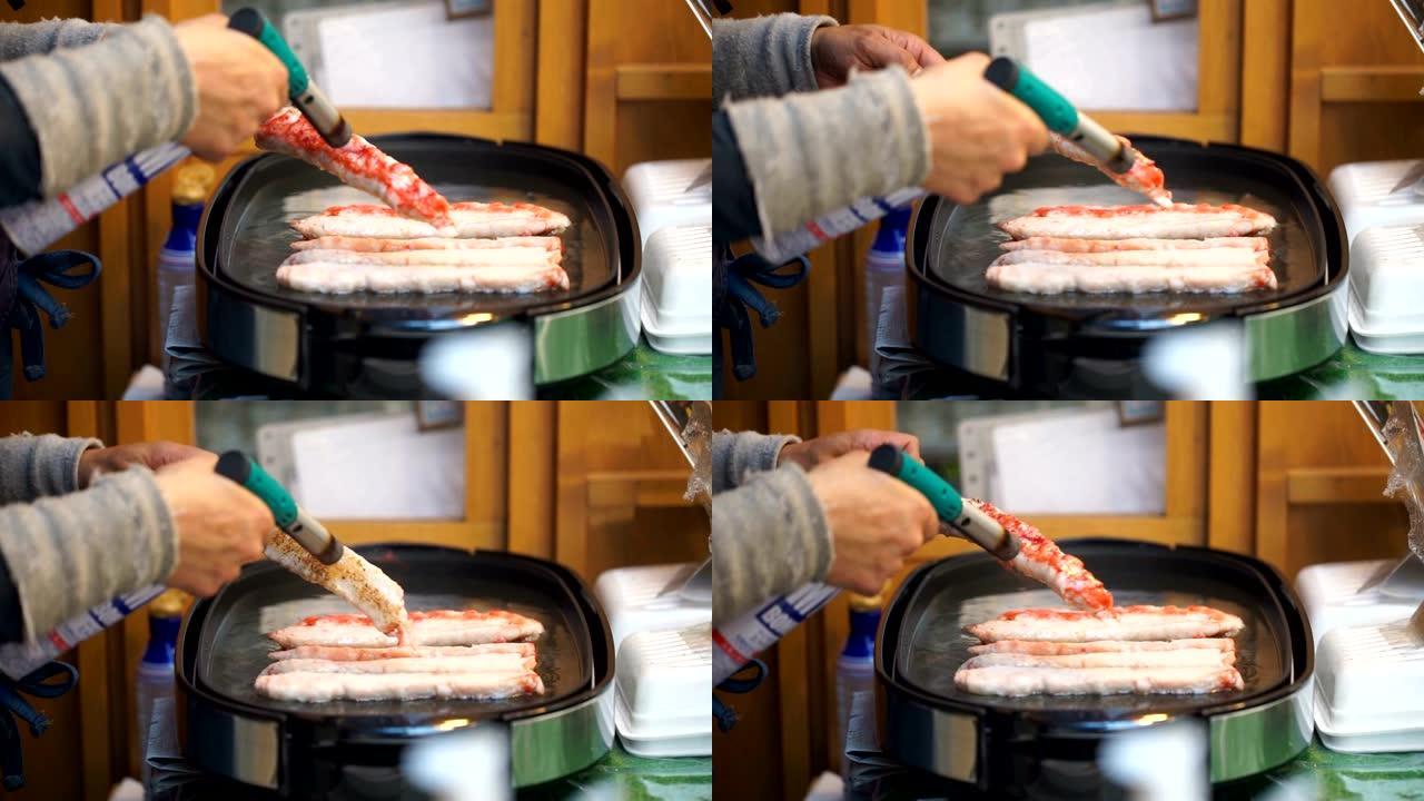 鱼街食品市场用烹饪丁烷火焰火炬点燃蟹肉