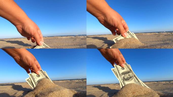 一个女孩从沙子里拿出了300美元的钞票。