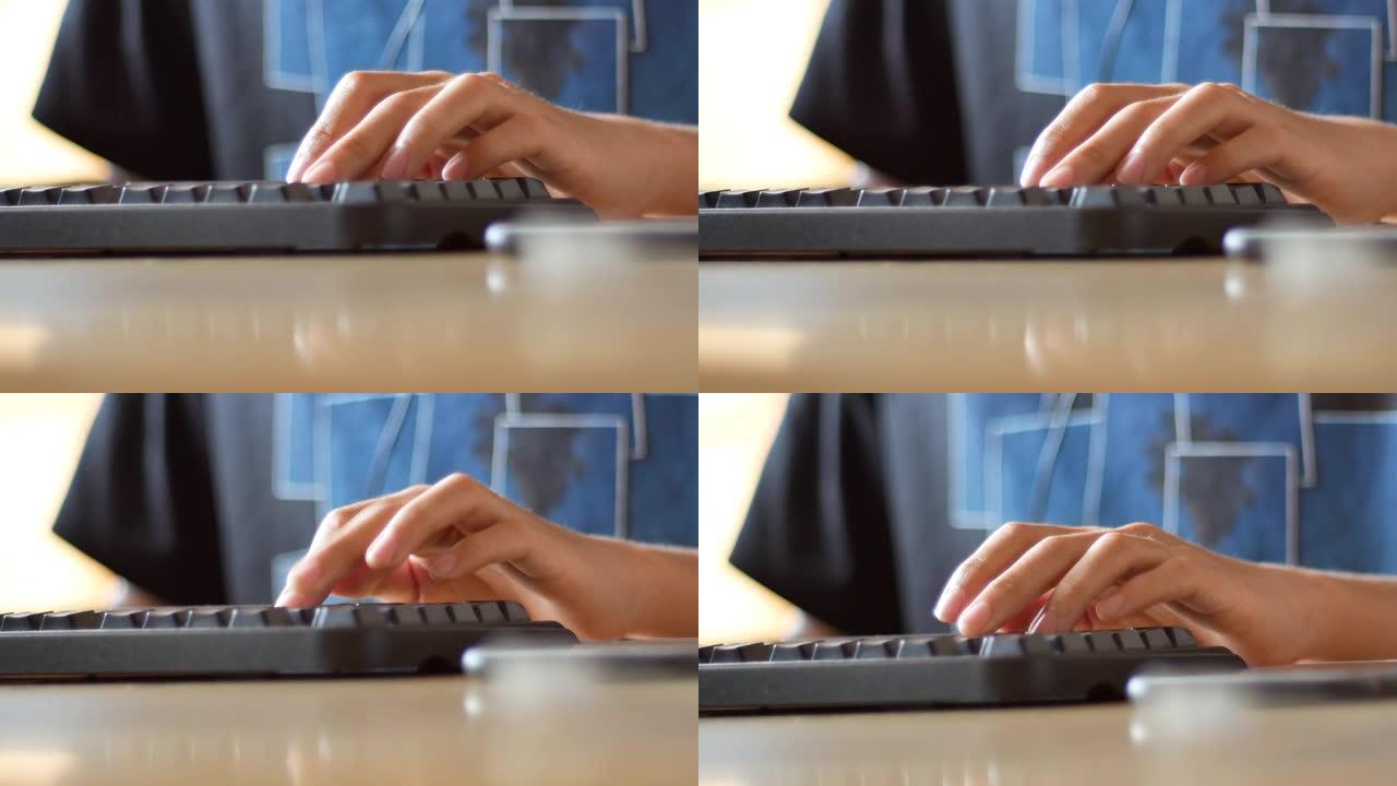 使用计算机场景，轻敲键盘的手