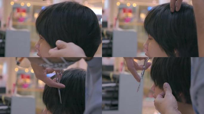 亚洲妇女在沙龙理发和造型。慢动作。