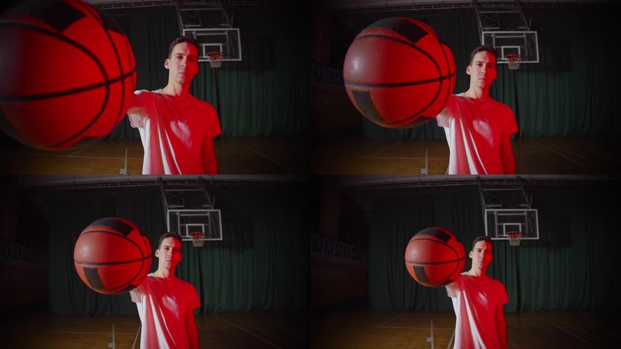 年轻的高加索篮球运动员在自信的背景下手持红光篮球