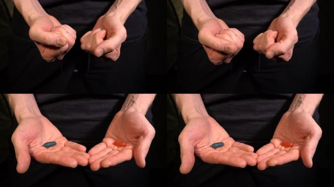黑衣人的手提供蓝色或红色的药丸或糖果。