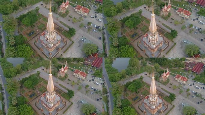 4K UHD无人机视图向后移动泰国普吉岛查隆寺。泰国普吉岛查龙寺是世界各地每个人的热门旅游目的地。