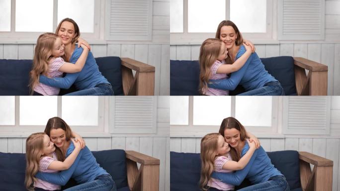 可爱的女孩子拥抱可爱的妈妈，拥有幸福和积极的情感。4k龙红相机
