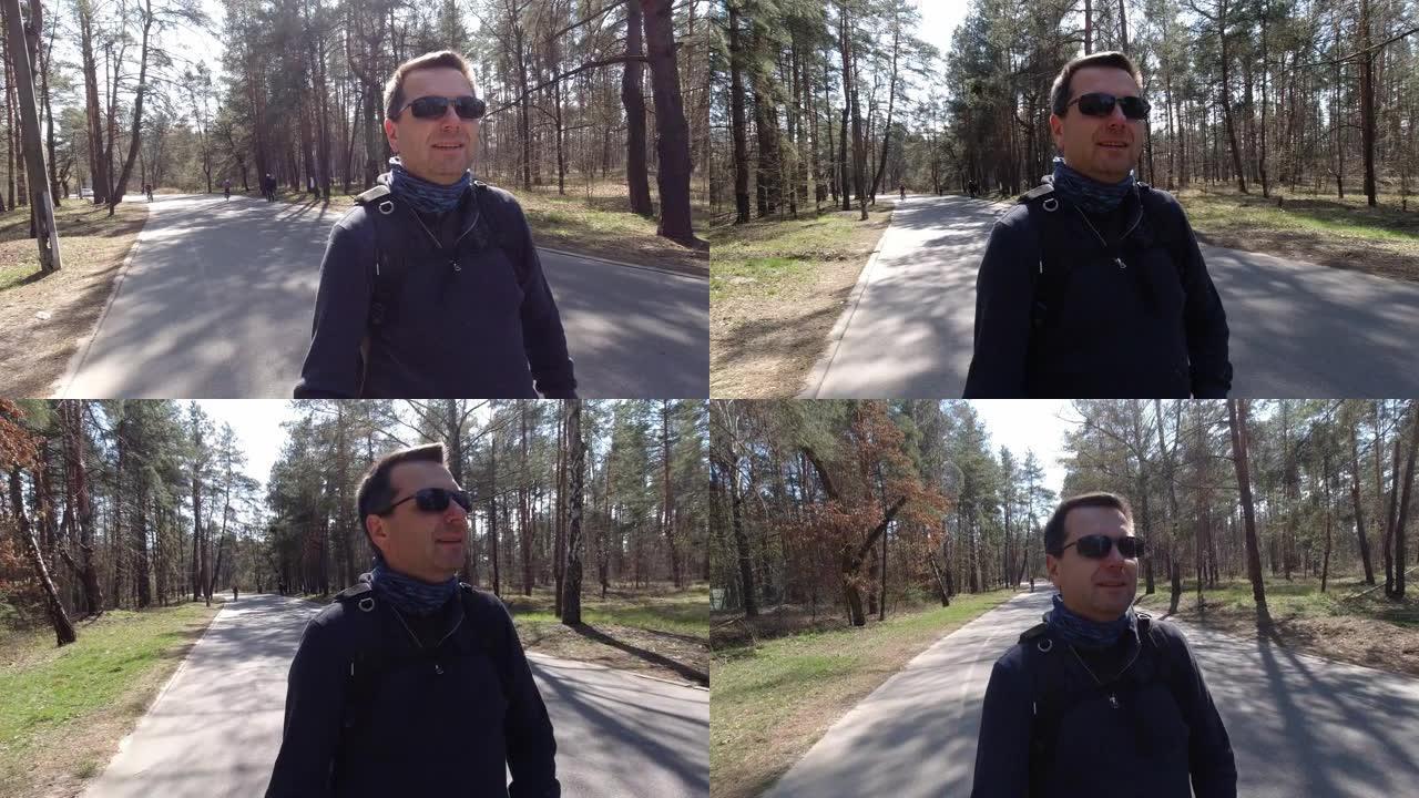 戴着太阳镜的自行车男子制作了自拍视频