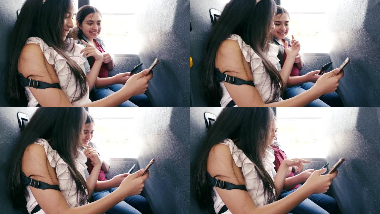 女中学生在校车上使用智能手机