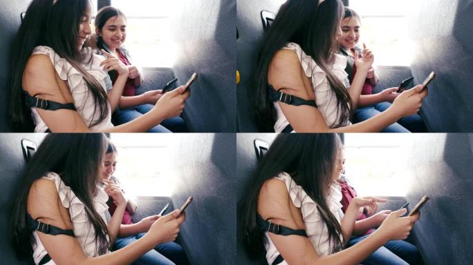 女中学生在校车上使用智能手机