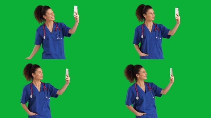 女医生用她的智能手机在色度键绿屏上进行视频通话，慢动作