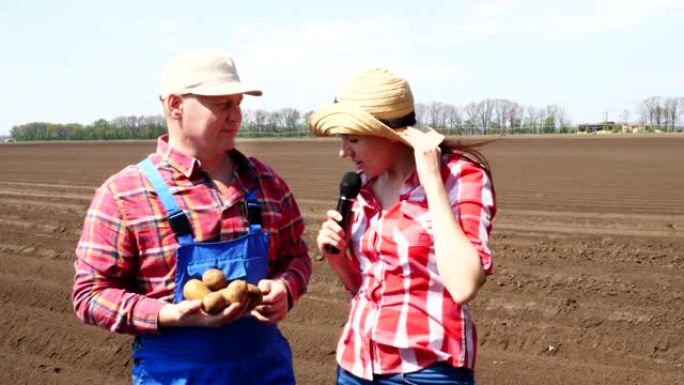 记者采访农民有关马铃薯种植或收获的电视新闻报道。现代农业种植。耕地背景
