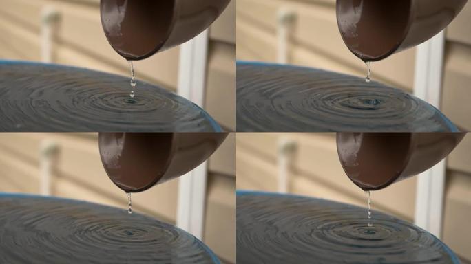 水滴滴入雨桶