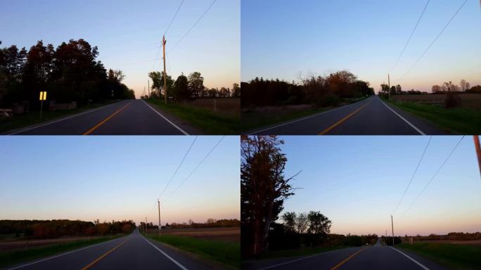 * 反向运动 * 在日落后退时间流逝期间驾驶乡村道路。黄昏傍晚时分，太阳在地平线上升起时，司机的观点