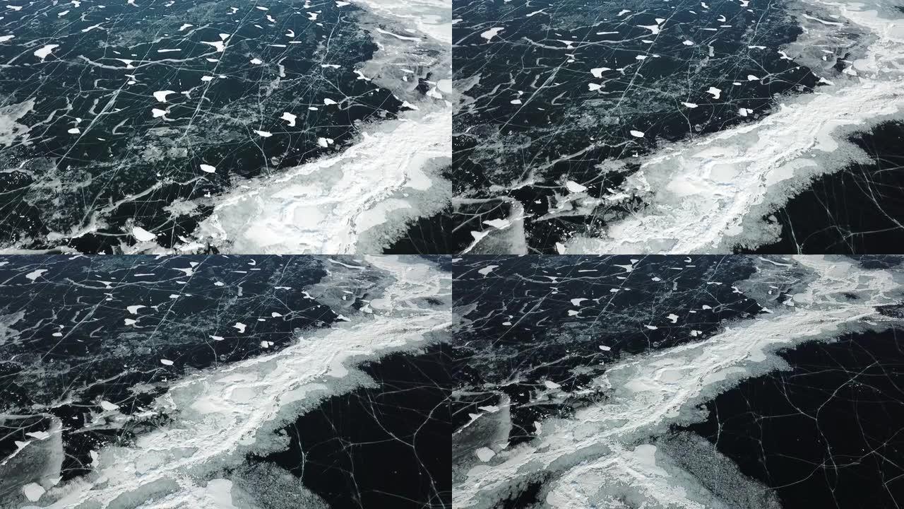 无人机在冬季贝加尔湖冰冻湖裂缝表面的美丽镜头。贝加尔湖是最大的淡水湖，也是世界上最深的