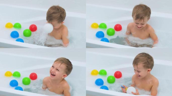 用肥皂泡沫洗澡的小男孩。可爱的男孩爱洗澡