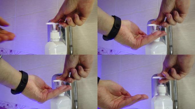 男子在浴室用肥皂彻底洗手。水从水龙头流出。防止感染。特写。冠状病毒大流行预防用肥皂温水洗手。
