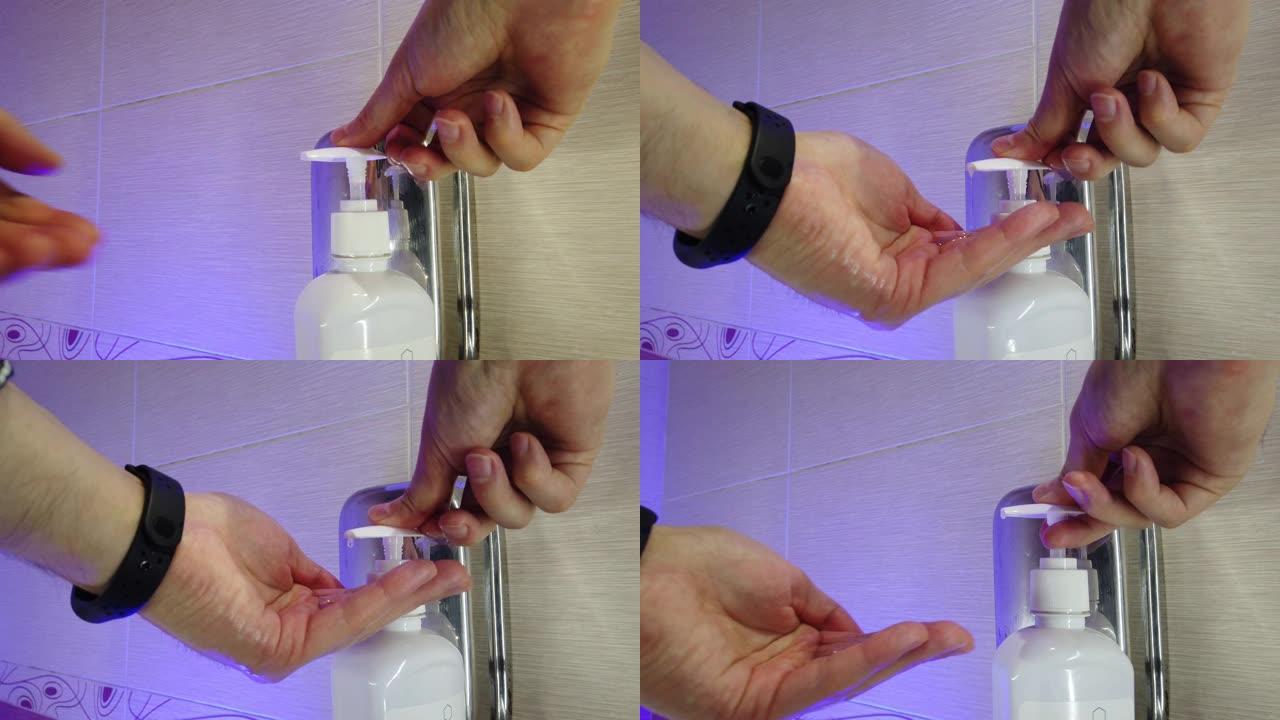 男子在浴室用肥皂彻底洗手。水从水龙头流出。防止感染。特写。冠状病毒大流行预防用肥皂温水洗手。
