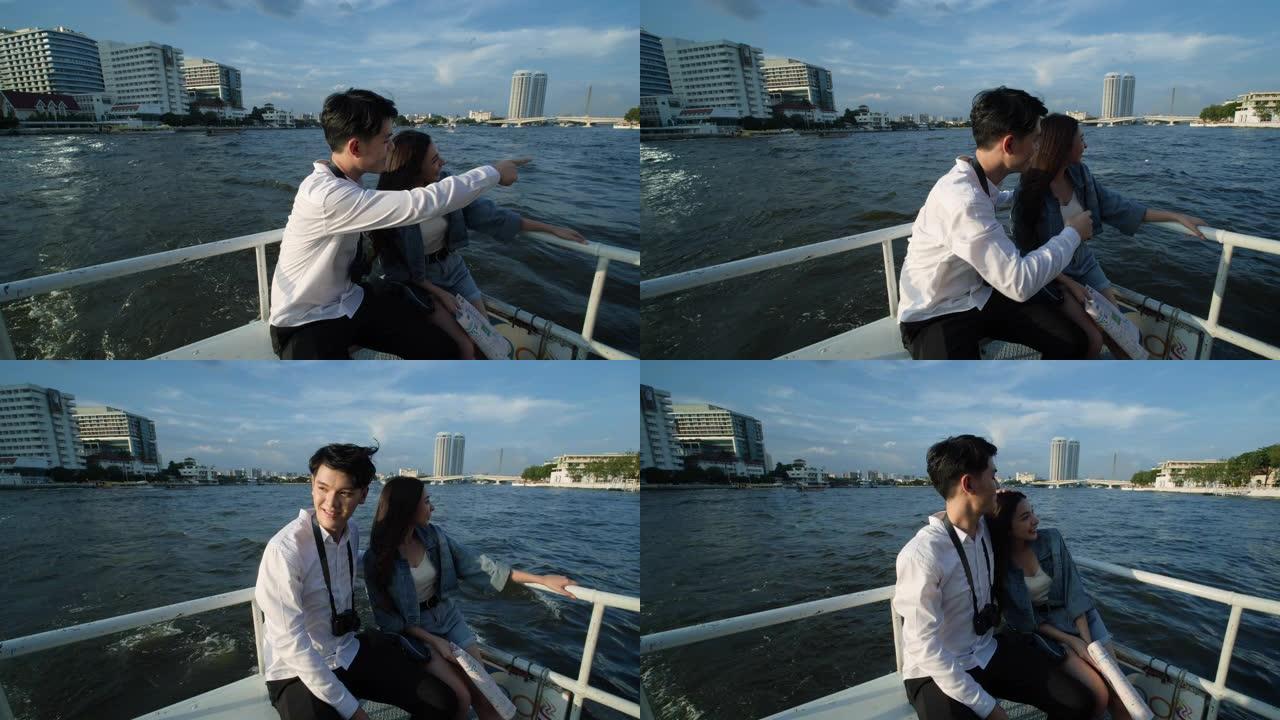 亚洲华人男女手持纸质地图。情人在泰国曼谷的河上旅行和坐船穿越存款。青少年参观两边河，观赏风景。