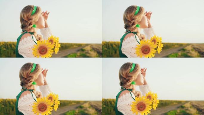 肖像美丽的年轻女子看起来丰收。花束黄色向日葵。发型公主金发辫子。绿色民族服装白色性感衬衫。背景蓝天开
