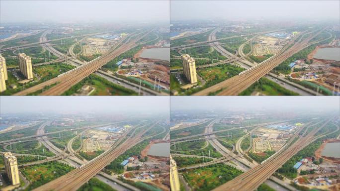 白天时间武汉城市汽车和火车交通枢纽航空全景4k倾斜移位中国