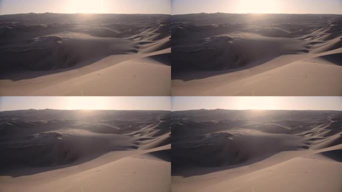 日落时秘鲁华卡中国村美丽的沙丘