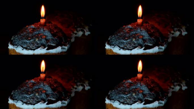 节日传统复活节蛋糕，黑色背景上有燃烧的蜡烛。复活节东正教甜面包。自制帕克斯假日概念