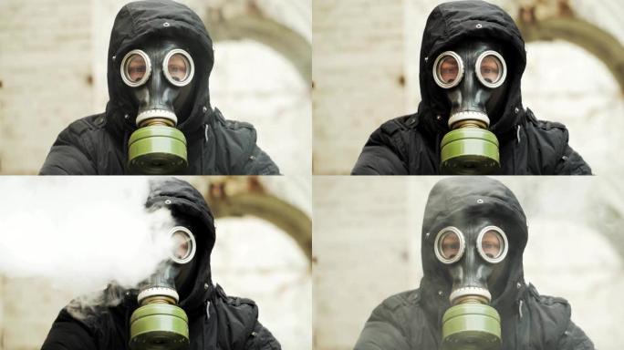 肖像。特写。烟雾中戴着防毒面具的人。环境污染的概念。生态灾难慢动作。