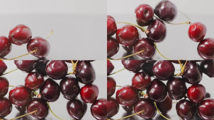 成熟的红色大樱桃的特写镜头慢慢落下，充满了屏幕。慢动作。浆果背景。全高清视频，240fps，1080