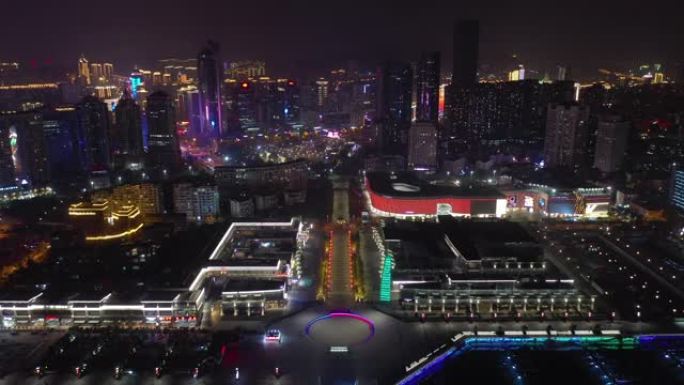 夜间照明青岛市著名奥林匹克湾广场交通街空中全景4k中国