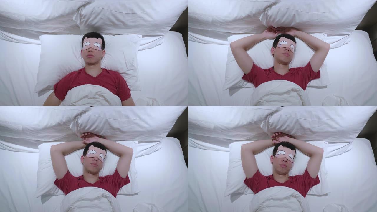 东南亚男子睡在卧室