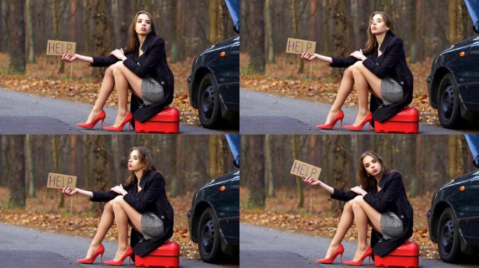 4 k。年轻性感的女子模特等待帮助，用红色油罐在路上索要汽油。