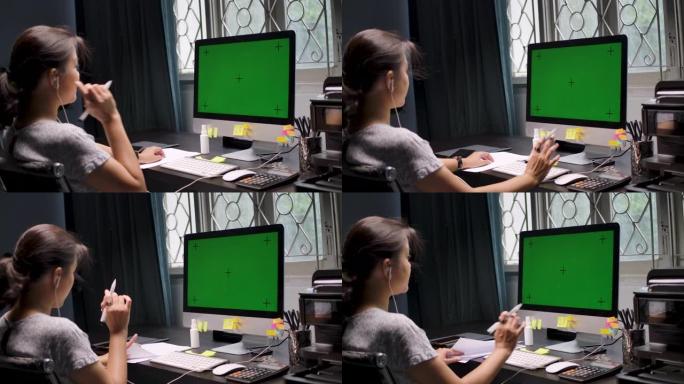 亚洲女商人在家用电脑工作，色度键
