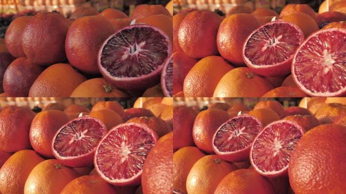水果市场上新鲜的橙子的特写镜头。农贸市场上装满成熟橙子的盒子。超市里的有机水果展示。蔬菜水果店摊位上