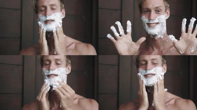 一幅男子肖像把剃须泡沫抹在脸上。