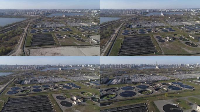 鸟瞰图。废水处理厂。背景城市。