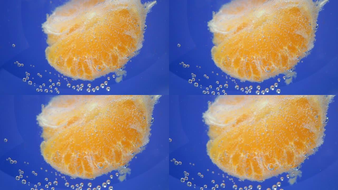 特写橘子果实，背景在水中，水下。背景，纹理