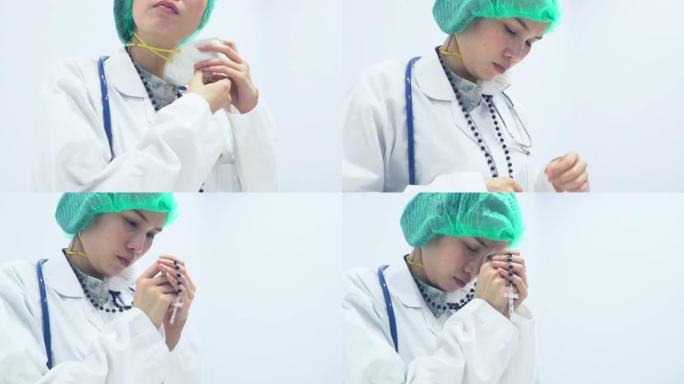 戴着面具的女医生在医院为她的病人祈祷上帝