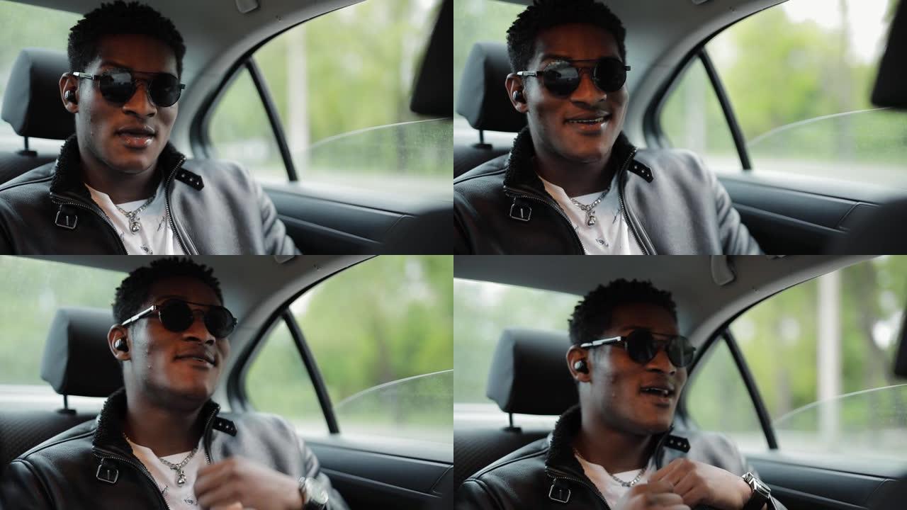 酷酷的非洲裔美国人坐在车里听音乐