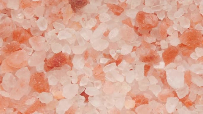 喜马拉雅盐白色和粉红色水晶美食质地，平移视频片段。