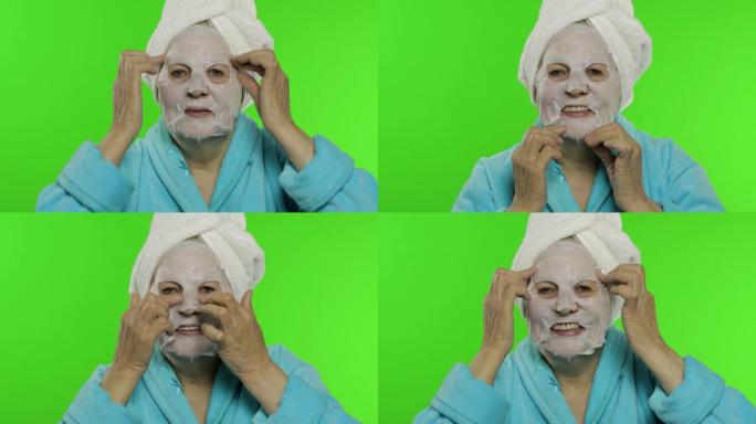 洗澡后的老奶奶。老妇人涂化妆品面料面膜
