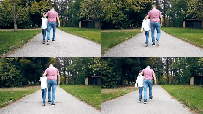 在公园的人行道上行走的男性Multl一代家庭的后视图，慢动作