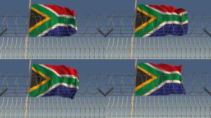 反对挥舞着南非国旗的铁丝网