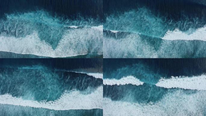 慢动作自上而下鸟瞰图的海洋巨浪，起泡和飞溅