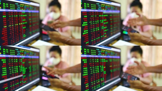 证券交易所市场业务。在智能手机上显示带有模糊红色图形的股票市场报价，患者戴着口罩。