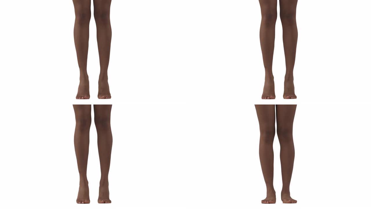 特写的苗条女性的腿。非洲妇女踮起脚尖。孤立，在白色背景上