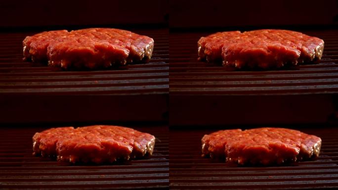 汉堡的生牛肉排在户外的烤架上油炸