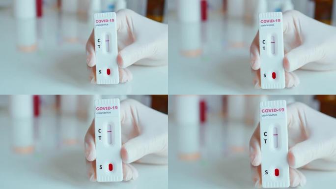 特写护士手握护手套手握快速血液测试进行新型冠状病毒肺炎分析