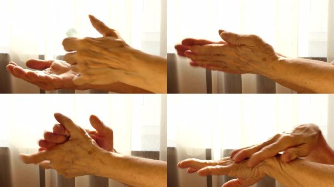 年长的白人妇女用酒精凝胶清洁双手帮助防止冠状病毒新型冠状病毒肺炎