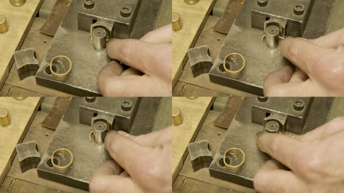 戈德史密斯用折弯机打造黄金结婚戒指，特写
