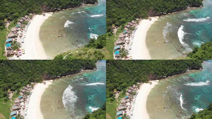 美丽的海湾海滩，绿松石海水，带许多雨伞顶视图航空照片，白色海滩和热带岛屿丛林