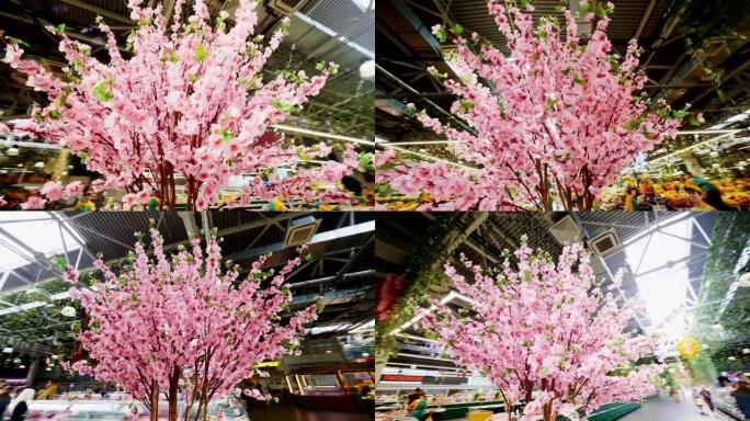 超市里美丽的粉色樱花周围的运动